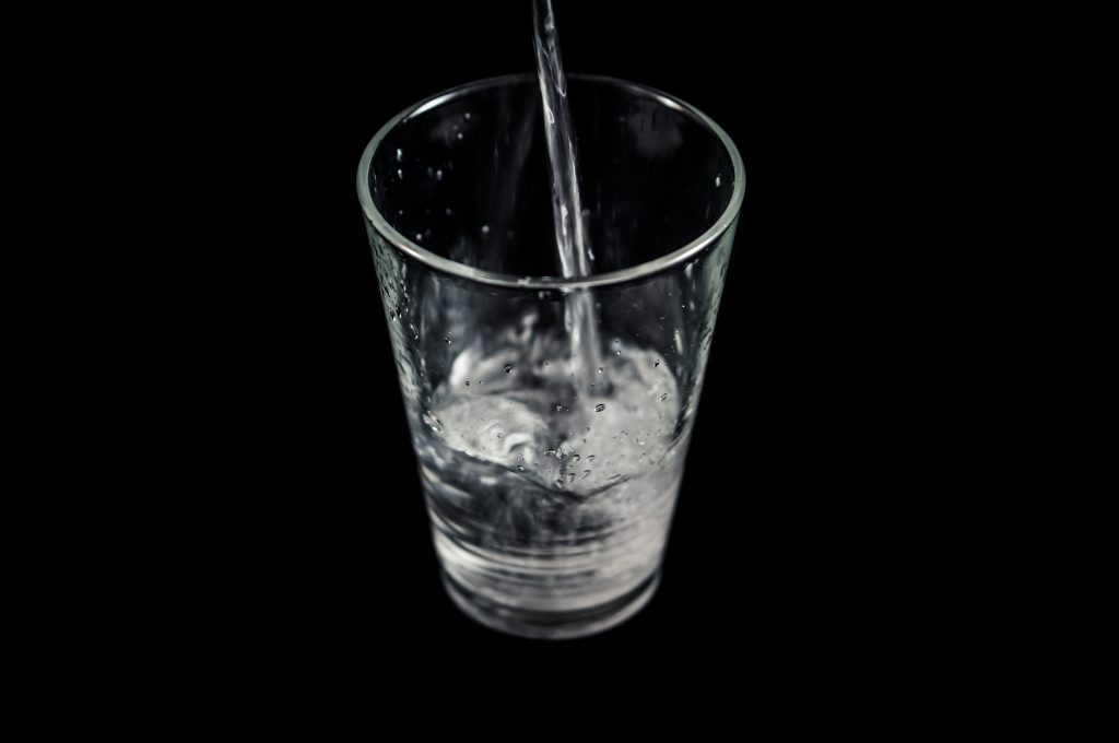 Pouring clean water into a glass